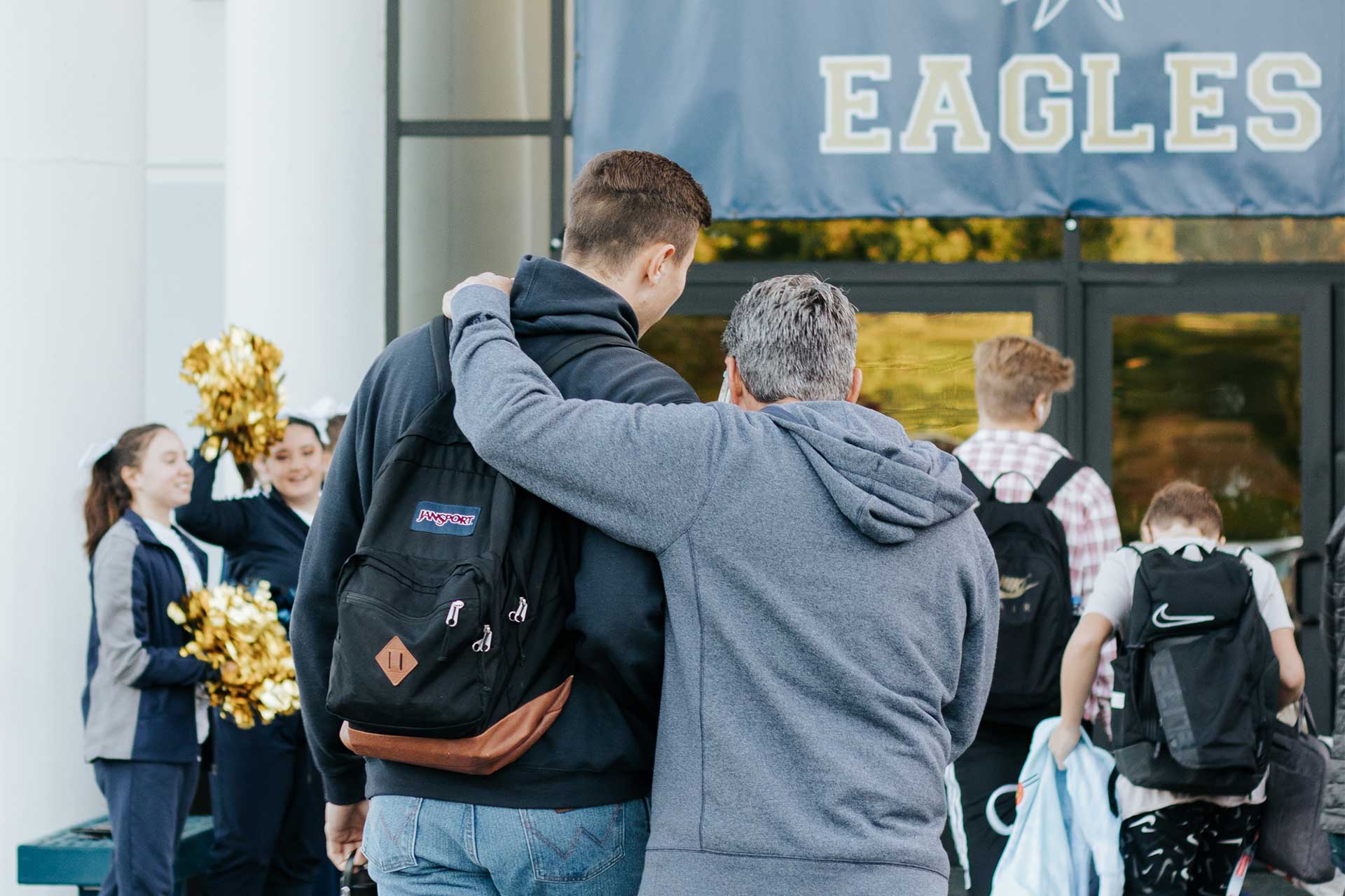 image of a student and superintendent walking towards class