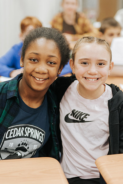 two young female students smiling