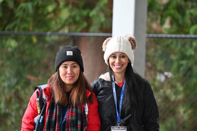 image of two female staff members smiling
