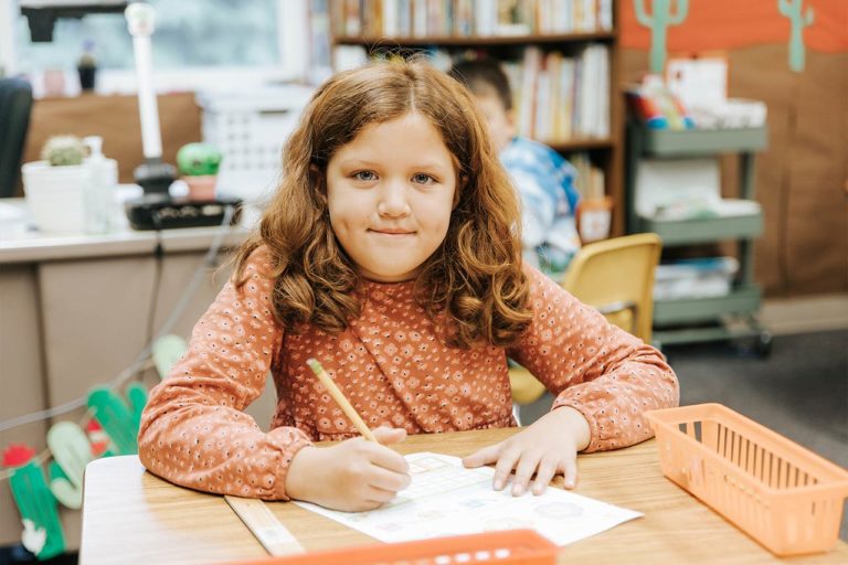 image of a young female student writing