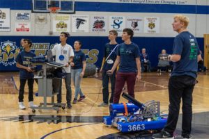 image of a group of students demonstrating their robot project