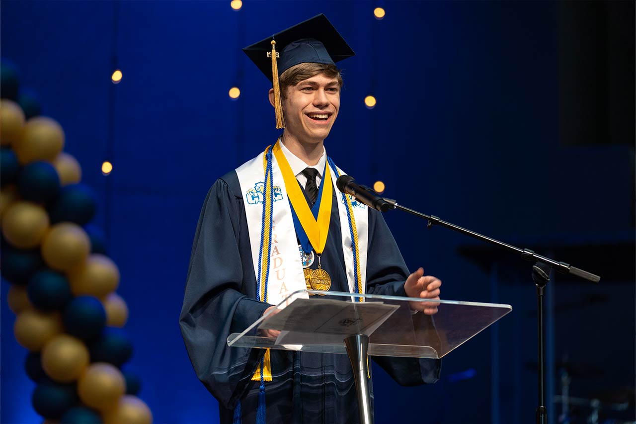 image of a young male college student giving a speach