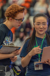 image of two female students at a robotics event