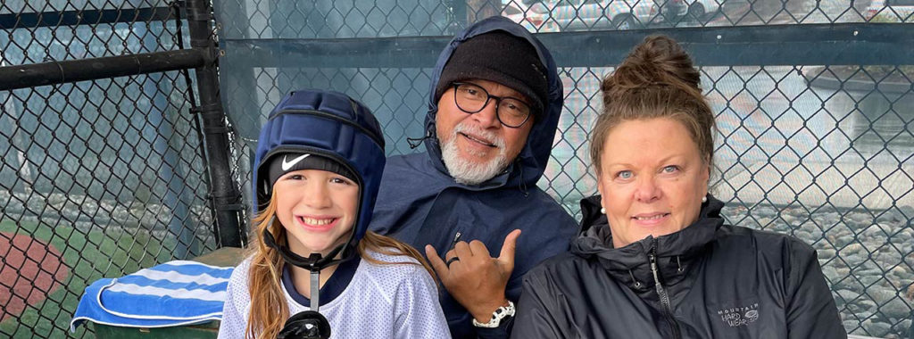 parents and child in CPC football gear